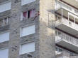 Naked man stuck to wall